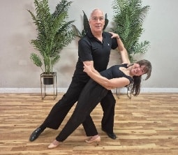 Couple dancing Latin ballroom in an elegant social dance setting